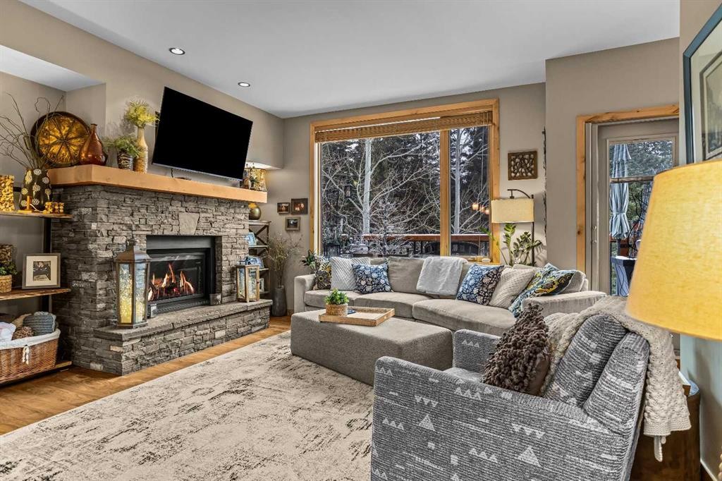 22 Streamside Lane, Canmore, AB - Indoor Photo Showing Living Room With Fireplace