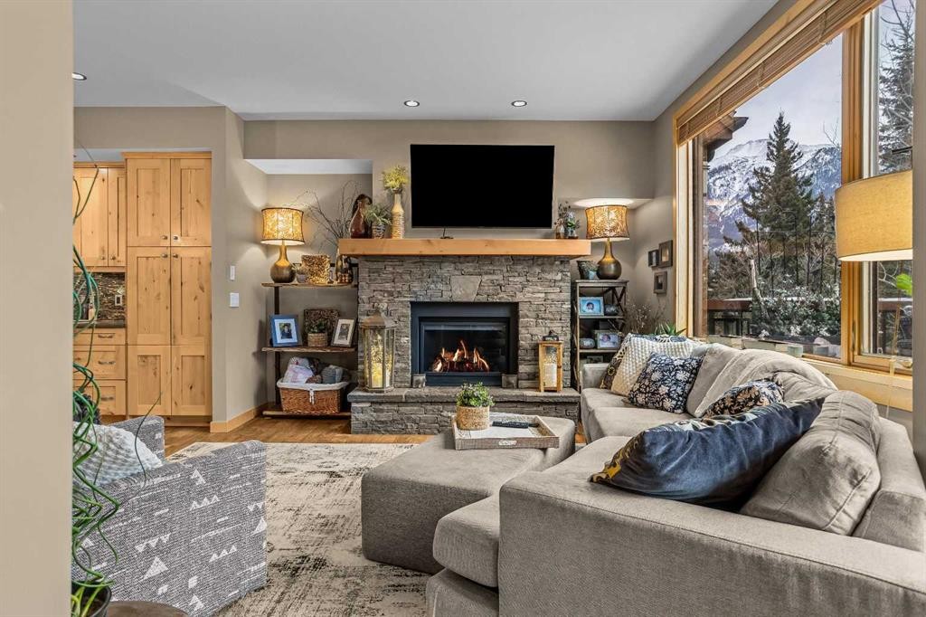 22 Streamside Lane, Canmore, AB - Indoor Photo Showing Living Room With Fireplace