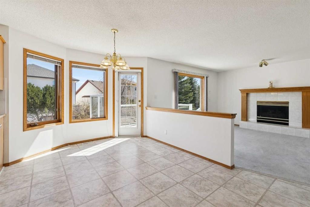 135 Sceptre Close Nw, Calgary, AB - Indoor With Fireplace