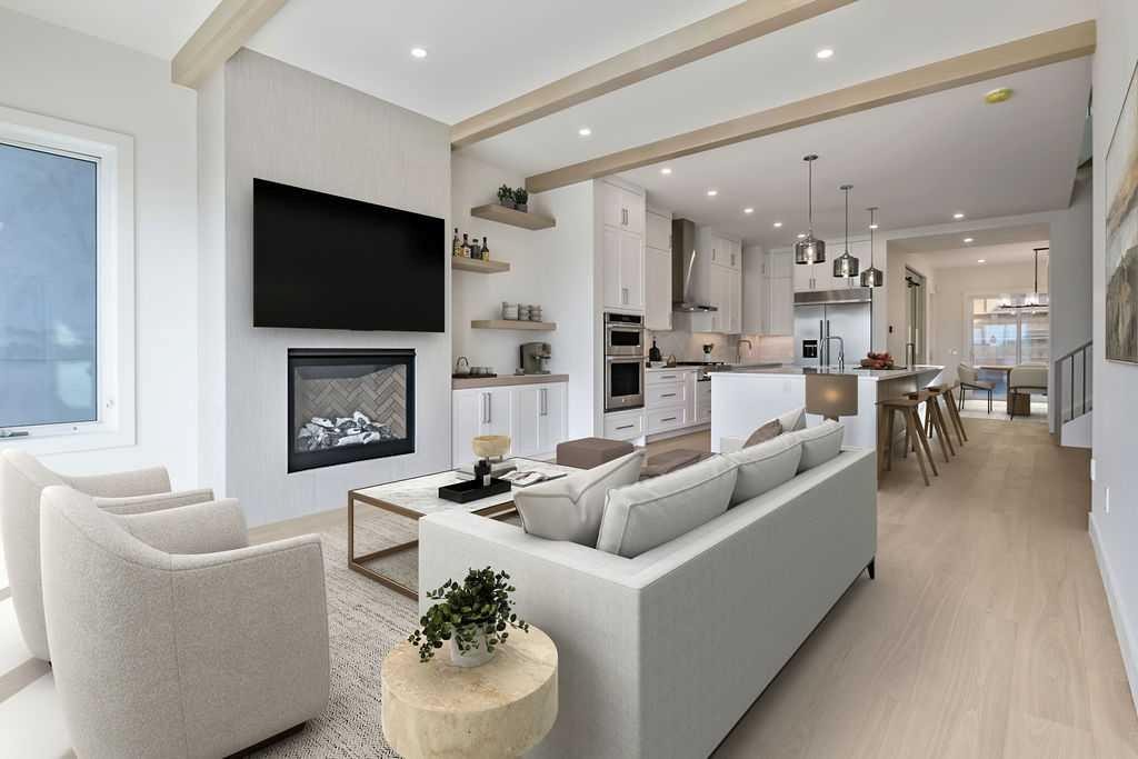 712 Bridge Crescent Ne, Calgary, AB - Indoor Photo Showing Living Room With Fireplace