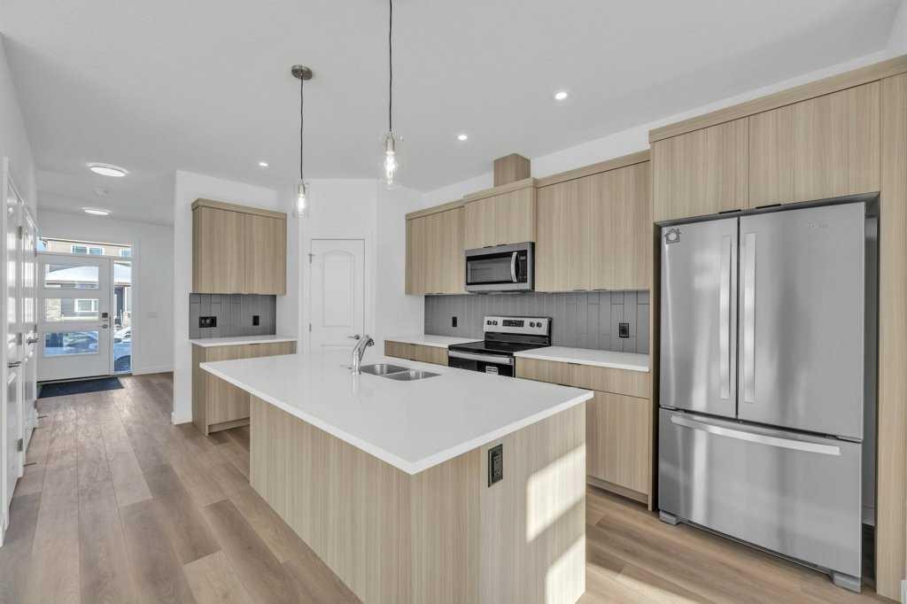 1115 Chinook Winds Circle Sw, Airdrie, AB - Indoor Photo Showing Kitchen With Stainless Steel Kitchen With Double Sink With Upgraded Kitchen