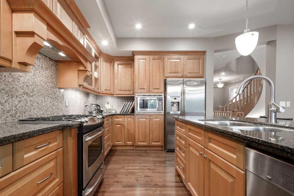 24 Aspen Meadows Green Sw, Calgary, AB - Indoor Photo Showing Kitchen With Stainless Steel Kitchen With Double Sink With Upgraded Kitchen