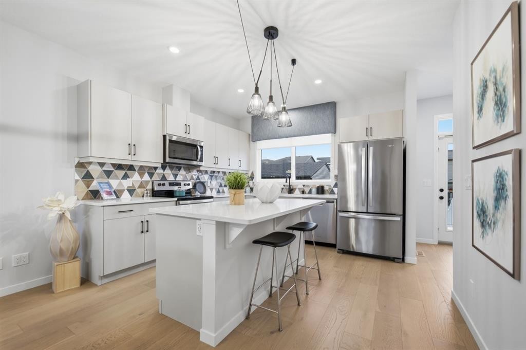 114 Wolf Creek Rise Se, Calgary, AB - Indoor Photo Showing Kitchen With Upgraded Kitchen