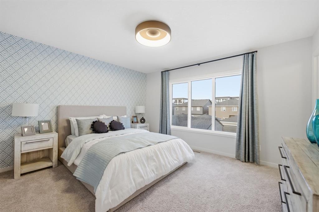 114 Wolf Creek Rise Se, Calgary, AB - Indoor Photo Showing Bedroom
