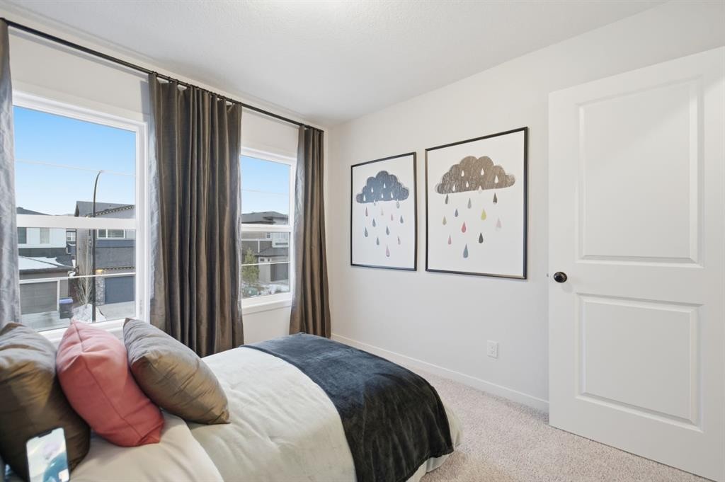114 Wolf Creek Rise Se, Calgary, AB - Indoor Photo Showing Bedroom