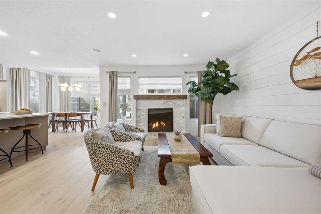 153 Cougarstone Common Sw, Calgary, AB - Indoor Photo Showing Living Room With Fireplace