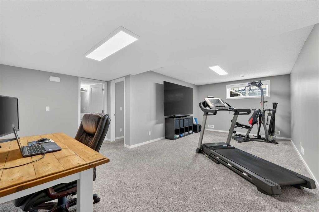 24 Walden Mount Se, Calgary, AB - Indoor Photo Showing Gym Room