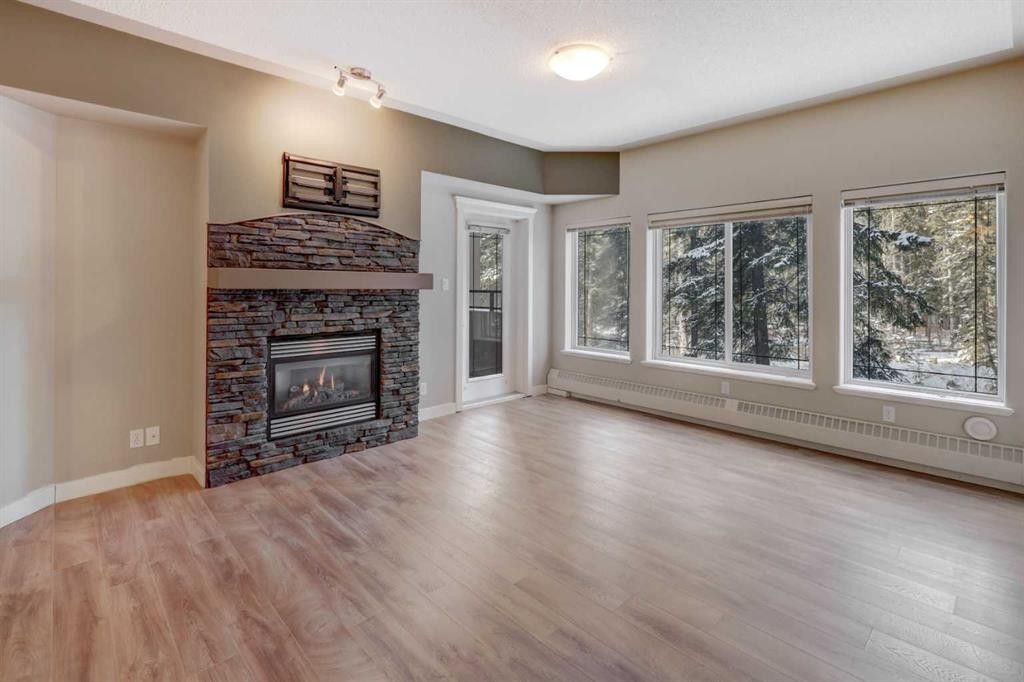 209-10 Discovery Ridge Close Sw, Calgary, AB - Indoor Photo Showing Living Room With Fireplace