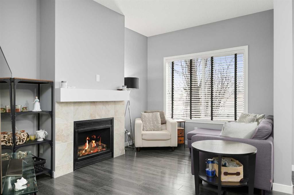 15 Copperpond Landing Se, Calgary, AB - Indoor Photo Showing Living Room With Fireplace