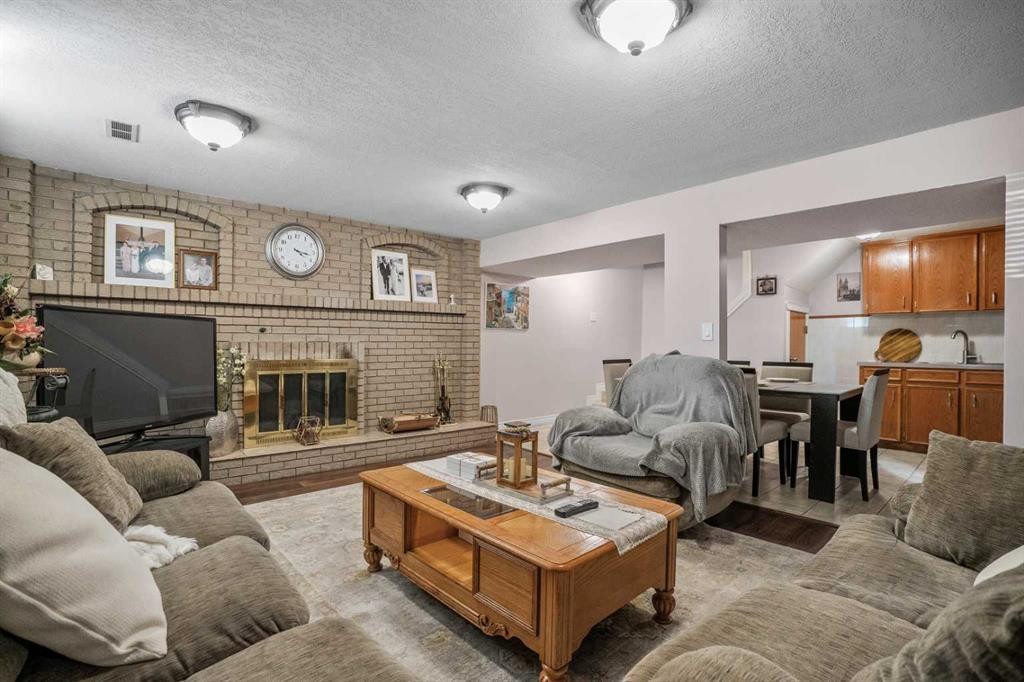 5004 Rundleview Road Ne, Calgary, AB - Indoor Photo Showing Living Room With Fireplace