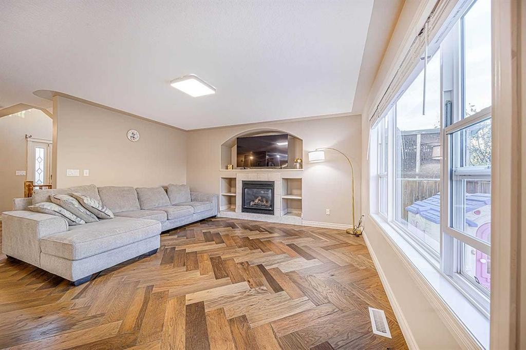 22 Royal Birch Way Nw, Calgary, AB - Indoor Photo Showing Living Room With Fireplace