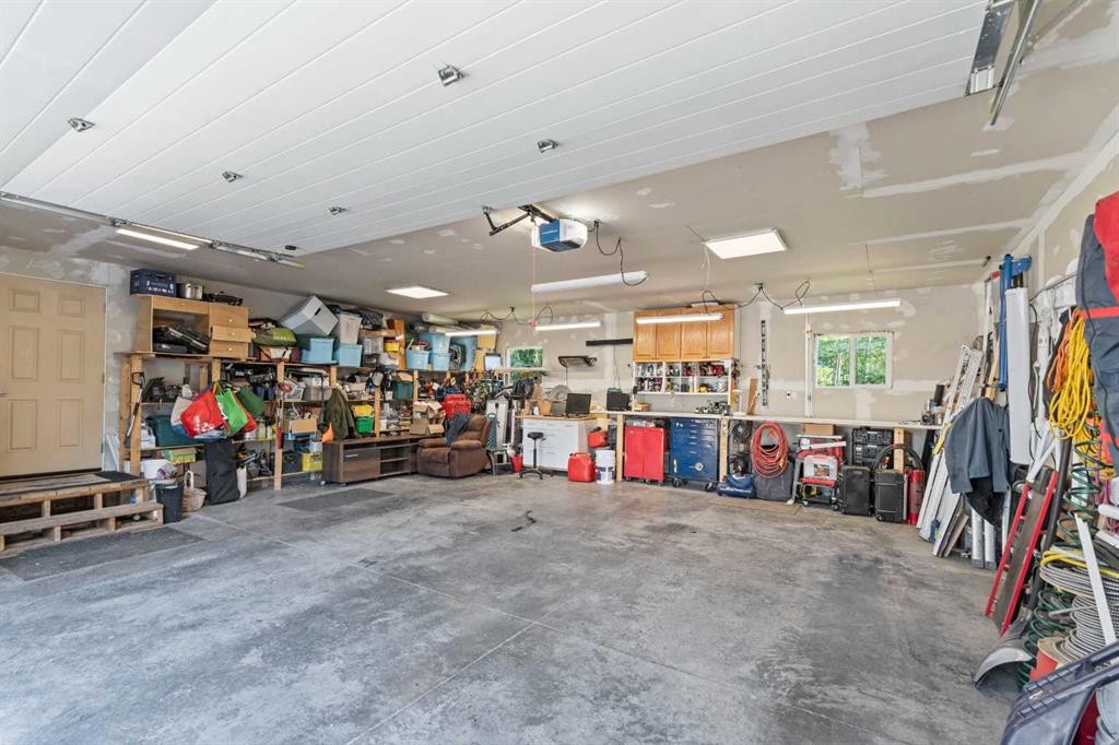 115 Dunham Lane, Diamond Valley, AB - Indoor Photo Showing Garage