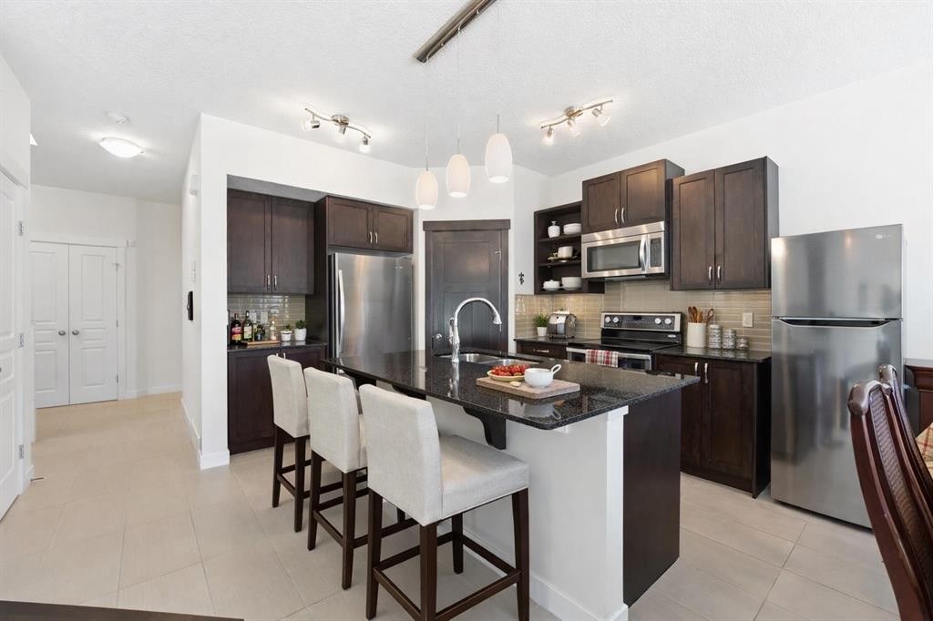 79 Cranford Green Se, Calgary, AB - Indoor Photo Showing Kitchen With Stainless Steel Kitchen With Upgraded Kitchen