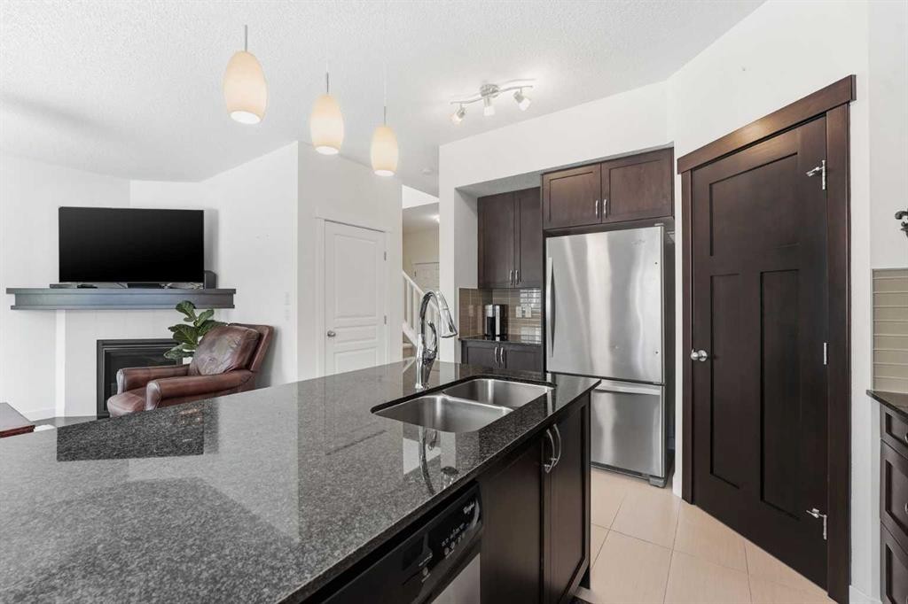 79 Cranford Green Se, Calgary, AB - Indoor Photo Showing Kitchen With Stainless Steel Kitchen With Double Sink With Upgraded Kitchen