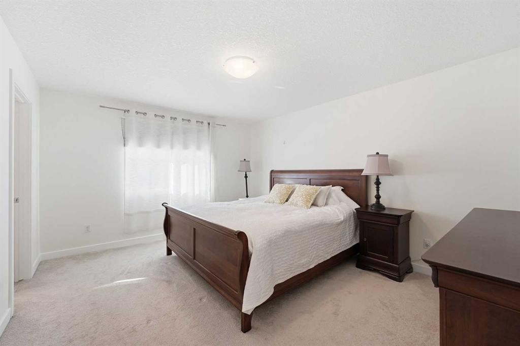 79 Cranford Green Se, Calgary, AB - Indoor Photo Showing Bedroom