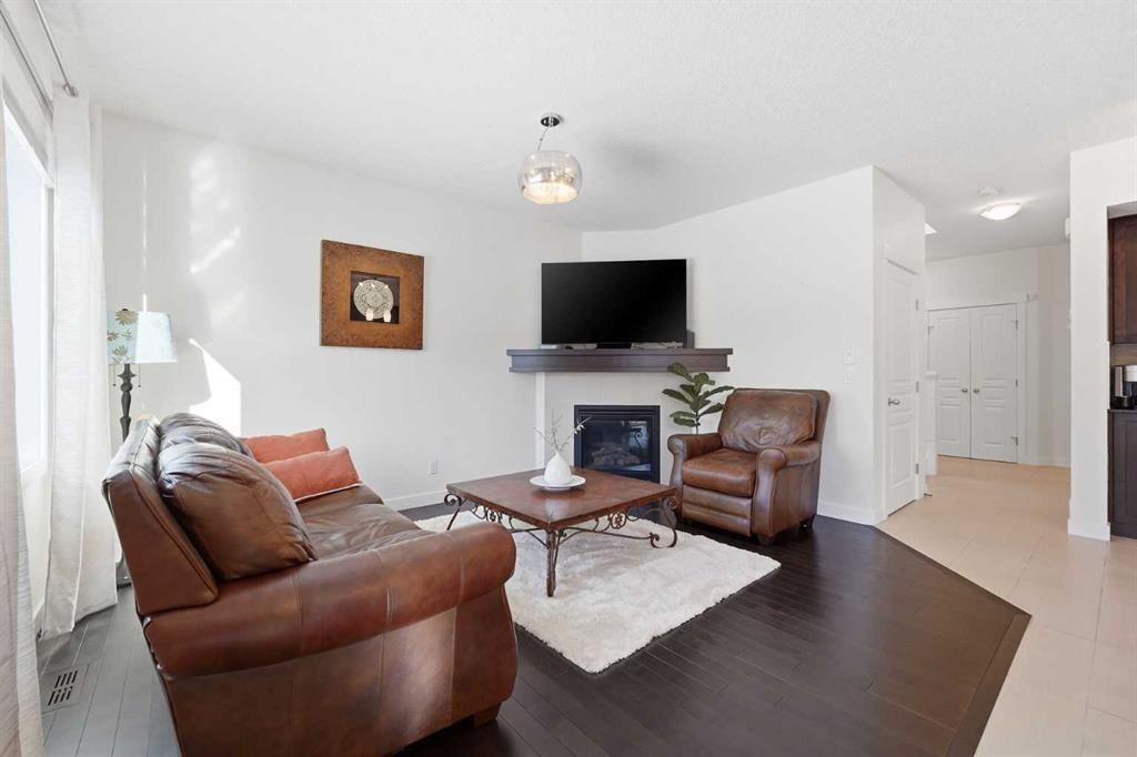 79 Cranford Green Se, Calgary, AB - Indoor Photo Showing Living Room With Fireplace