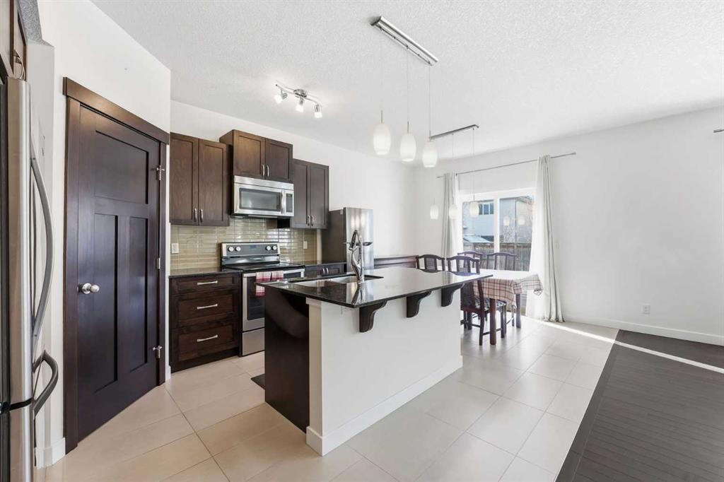 79 Cranford Green Se, Calgary, AB - Indoor Photo Showing Kitchen With Stainless Steel Kitchen With Upgraded Kitchen