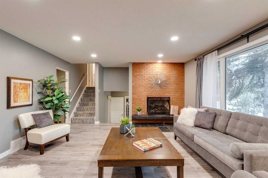 4023 Varmoor Road Nw, Calgary, AB - Indoor Photo Showing Living Room With Fireplace
