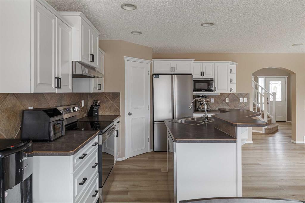 51 Brightondale Crescent Se, Calgary, AB - Indoor Photo Showing Kitchen With Double Sink