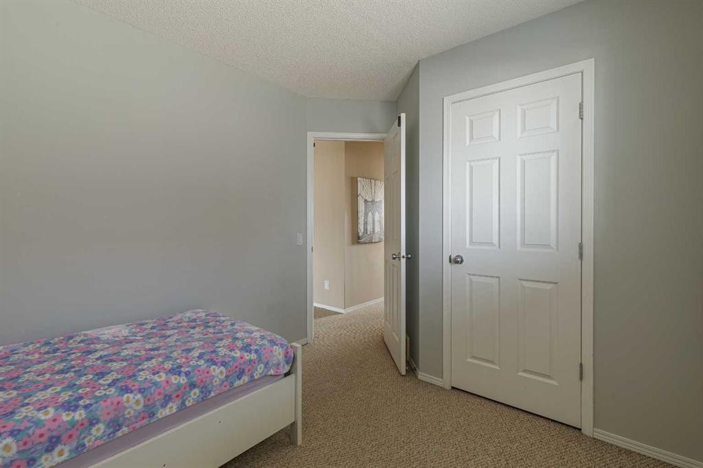 51 Brightondale Crescent Se, Calgary, AB - Indoor Photo Showing Bedroom
