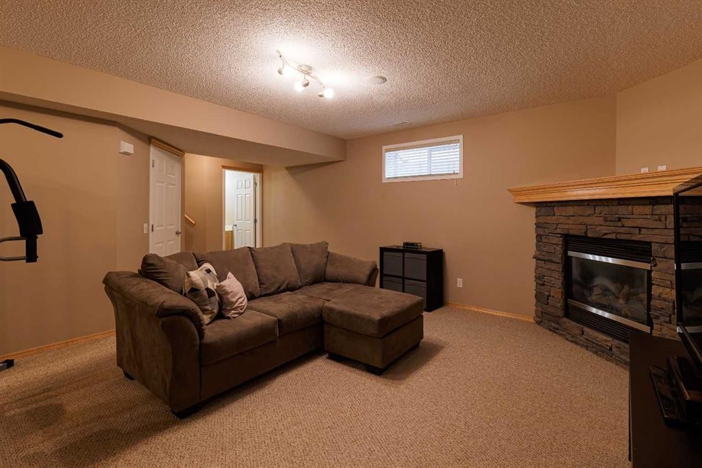 51 Brightondale Crescent Se, Calgary, AB - Indoor Photo Showing Other Room With Fireplace