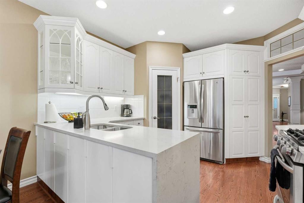 23 Prominence Point Sw, Calgary, AB - Indoor Photo Showing Kitchen With Stainless Steel Kitchen With Double Sink