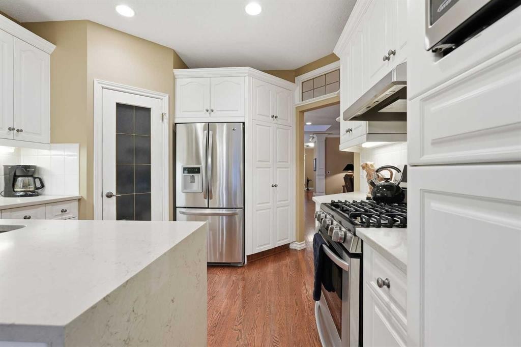 23 Prominence Point Sw, Calgary, AB - Indoor Photo Showing Kitchen With Stainless Steel Kitchen With Upgraded Kitchen