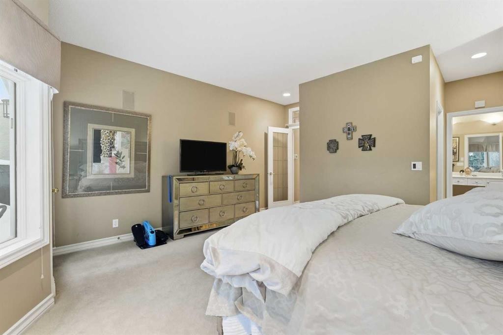23 Prominence Point Sw, Calgary, AB - Indoor Photo Showing Bedroom