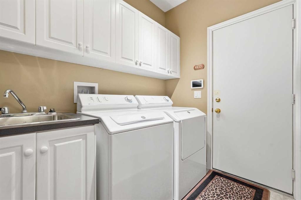 23 Prominence Point Sw, Calgary, AB - Indoor Photo Showing Laundry Room