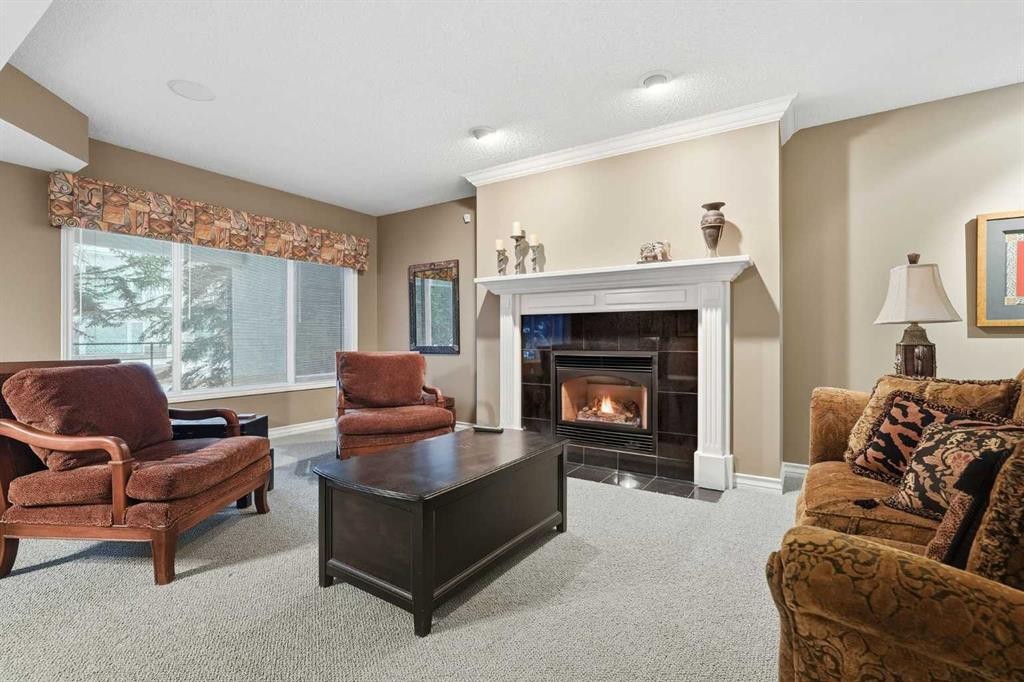 23 Prominence Point Sw, Calgary, AB - Indoor Photo Showing Living Room With Fireplace
