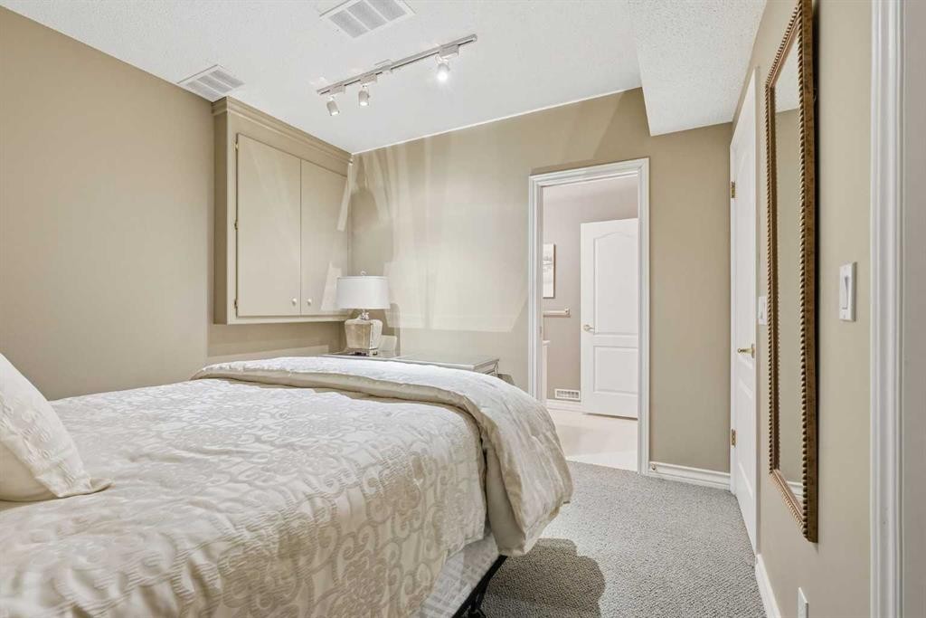 23 Prominence Point Sw, Calgary, AB - Indoor Photo Showing Bedroom