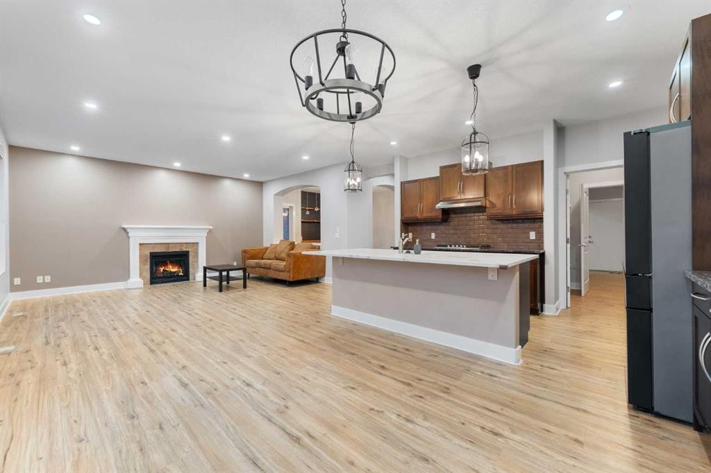 70 Royal Ridge Manor Nw, Calgary, AB - Indoor Photo Showing Kitchen With Fireplace