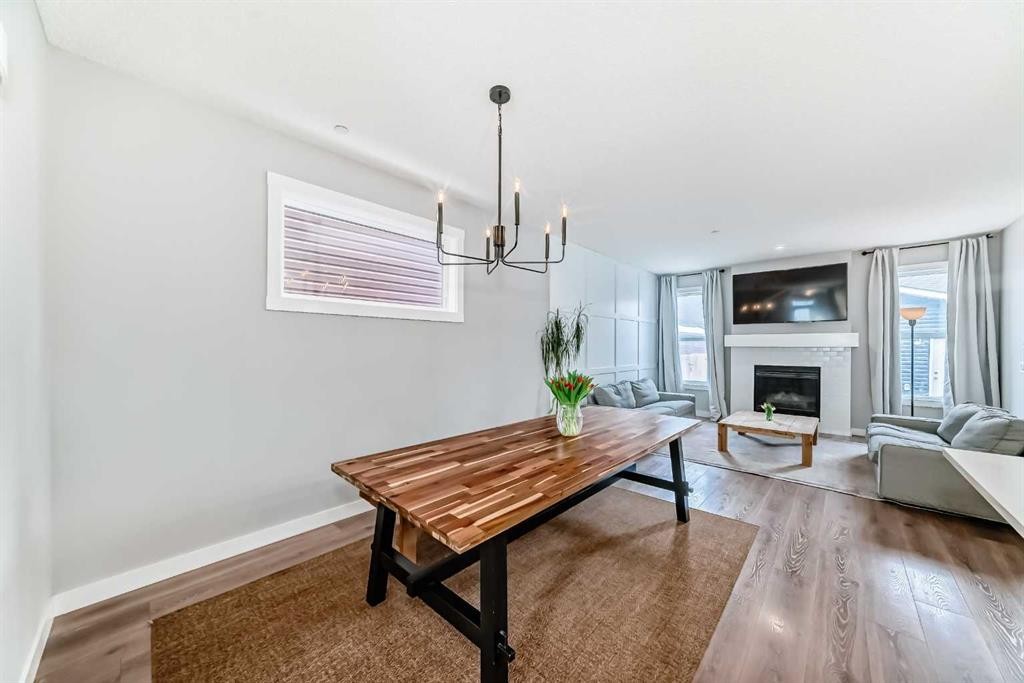 129 Lucas Crescent Nw, Calgary, AB - Indoor Photo Showing Living Room With Fireplace
