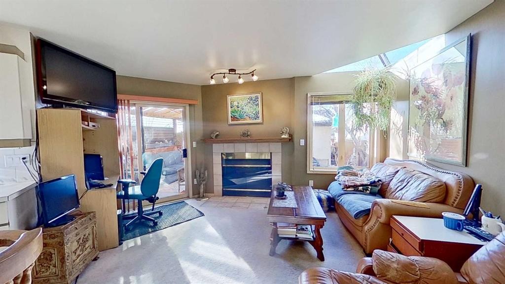 2219 Westmount Road Nw, Calgary, AB - Indoor Photo Showing Living Room With Fireplace