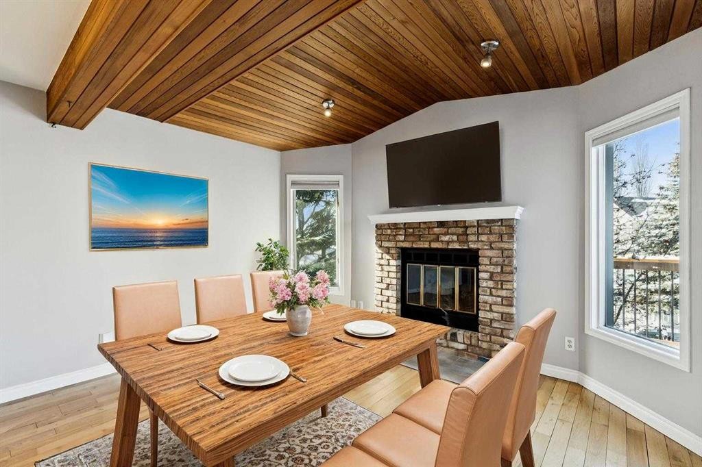 136 Scenic Acres Drive Nw, Calgary, AB - Indoor Photo Showing Dining Room With Fireplace