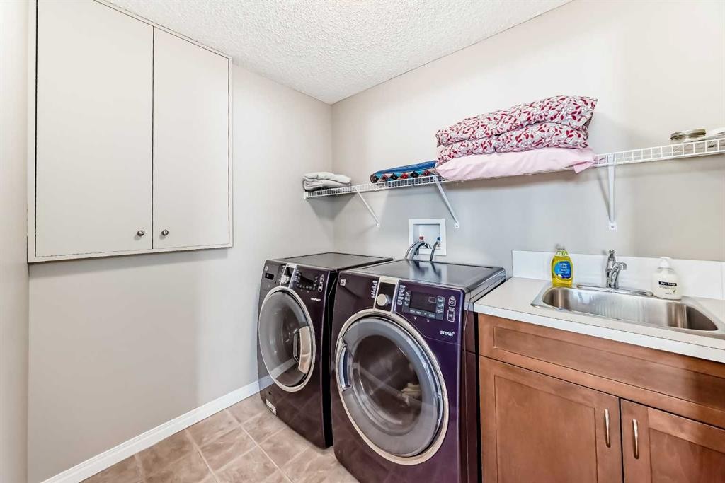 266 Fireside Place, Cochrane, AB - Indoor Photo Showing Laundry Room
