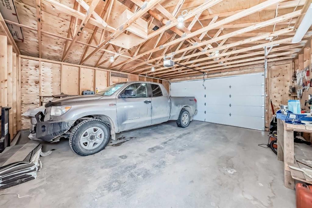 266 Fireside Place, Cochrane, AB - Indoor Photo Showing Garage