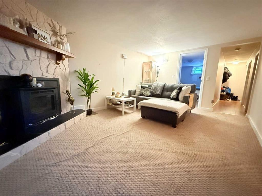 37 Arbour Crescent Se, Calgary, AB - Indoor Photo Showing Living Room With Fireplace
