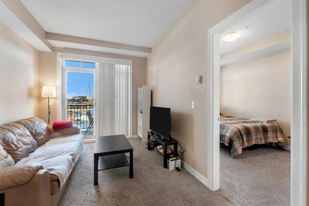 312-117 Copperpond Common Se, Calgary, AB - Indoor Photo Showing Living Room