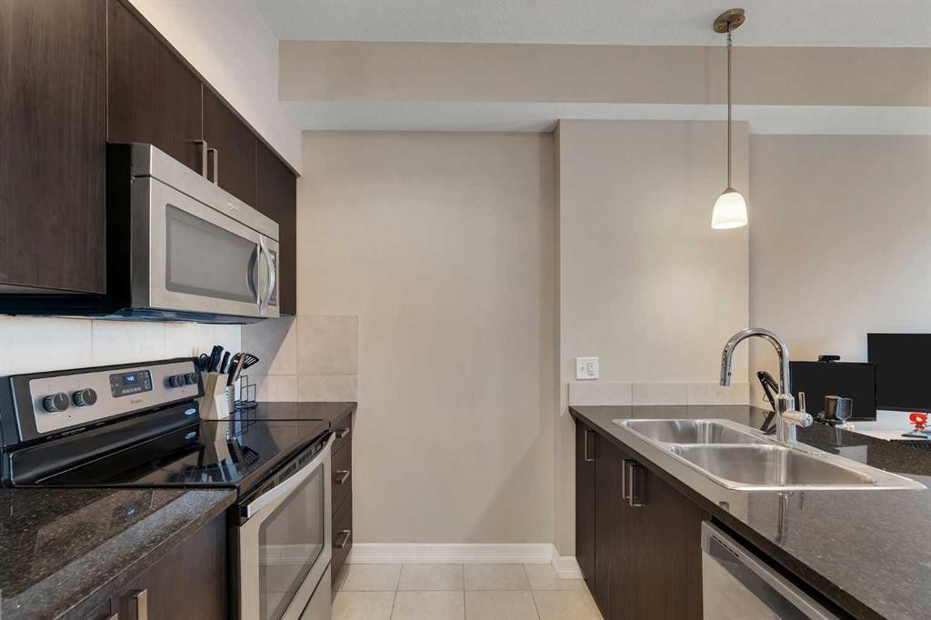 312-117 Copperpond Common Se, Calgary, AB - Indoor Photo Showing Kitchen With Stainless Steel Kitchen With Double Sink
