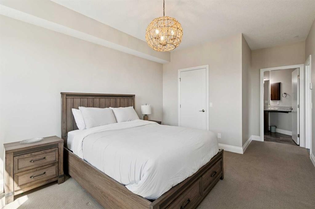 2302-15 Sunset Square, Cochrane, AB - Indoor Photo Showing Bedroom
