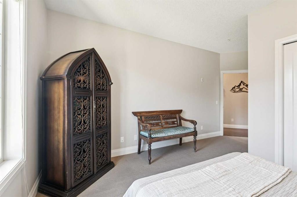 2302-15 Sunset Square, Cochrane, AB - Indoor Photo Showing Bedroom