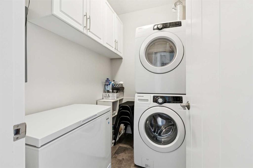 2302-15 Sunset Square, Cochrane, AB - Indoor Photo Showing Laundry Room