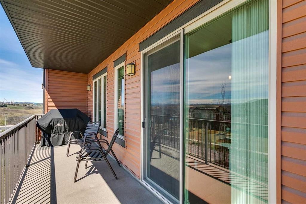 2302-15 Sunset Square, Cochrane, AB - Outdoor With Deck Patio Veranda With Exterior