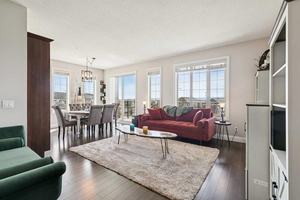 2302-15 Sunset Square, Cochrane, AB - Indoor Photo Showing Living Room