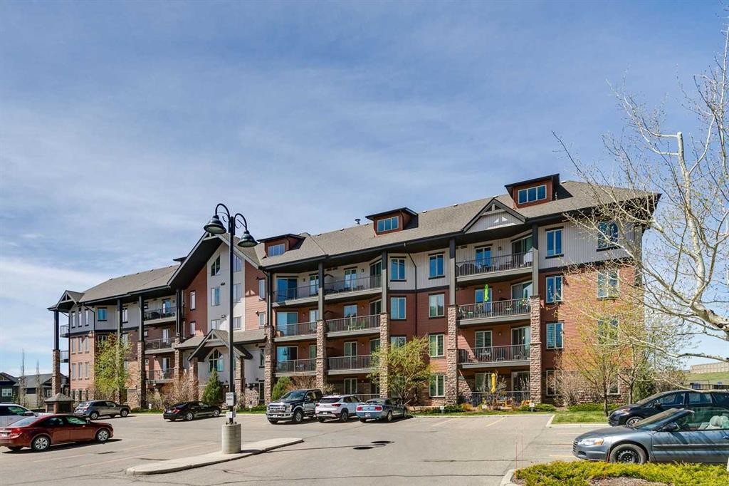 2302-15 Sunset Square, Cochrane, AB - Outdoor With Balcony With Facade
