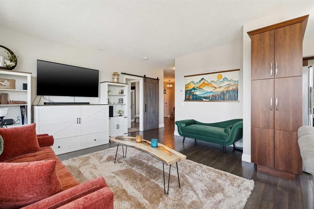 2302-15 Sunset Square, Cochrane, AB - Indoor Photo Showing Living Room