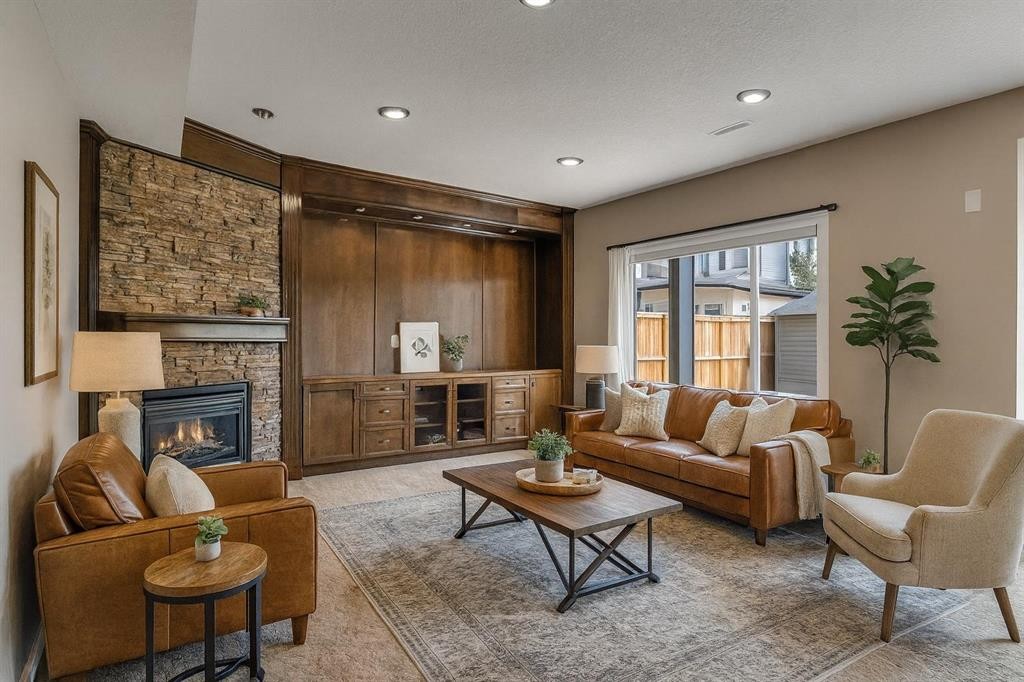202 Coral Reef Manor Ne, Calgary, AB - Indoor Photo Showing Living Room With Fireplace