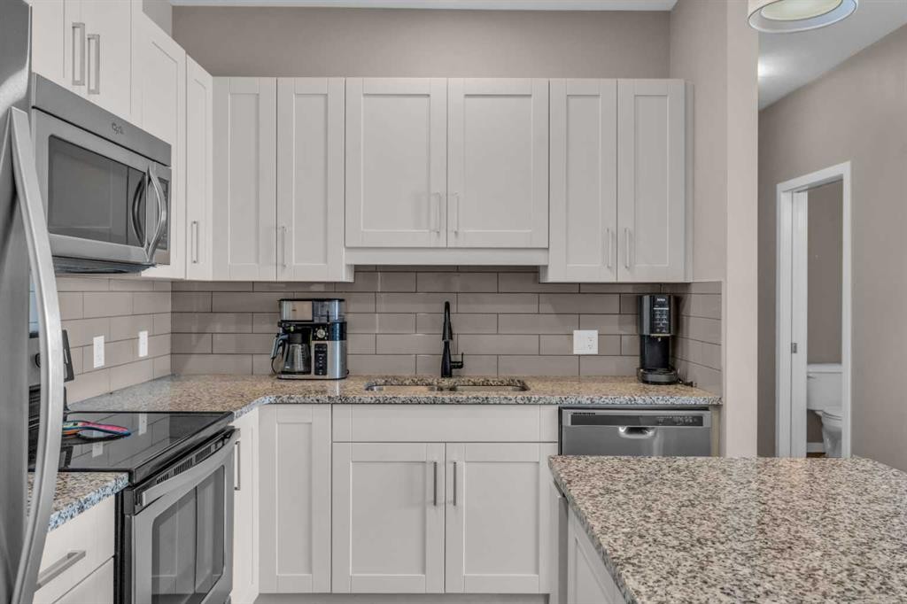 93 Copperstone Common Se, Calgary, AB - Indoor Photo Showing Kitchen With Stainless Steel Kitchen With Double Sink With Upgraded Kitchen