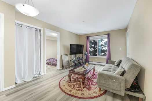 215-355 Taralake Way Ne, Calgary, AB - Indoor Photo Showing Living Room